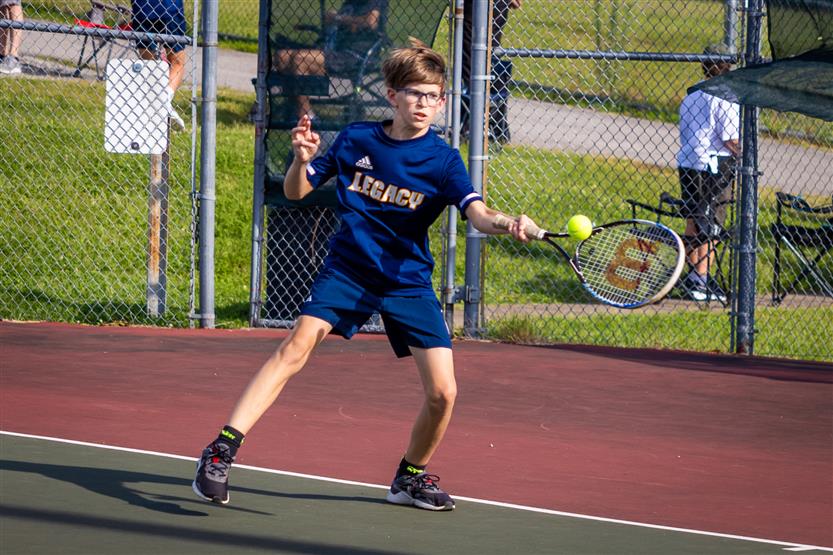 Students play tennis